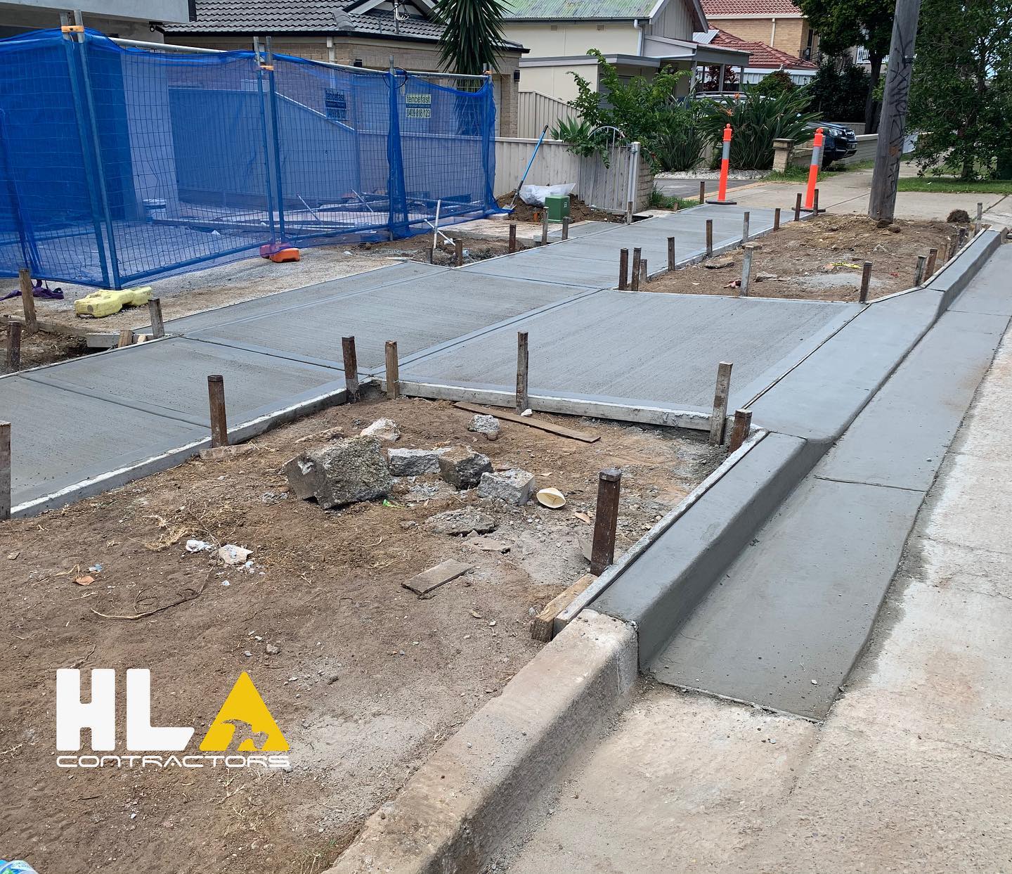 Civil works: concrete path and kerb with site fencing