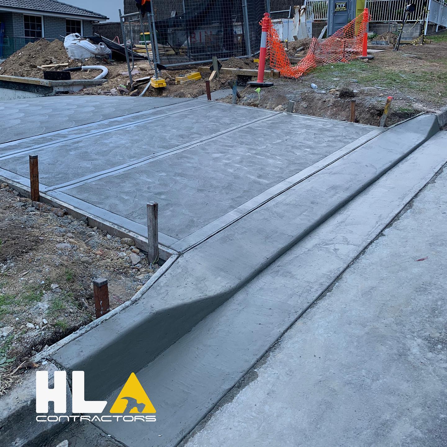 Civil works: new concrete driveway, kerb, and crossover at a residential site