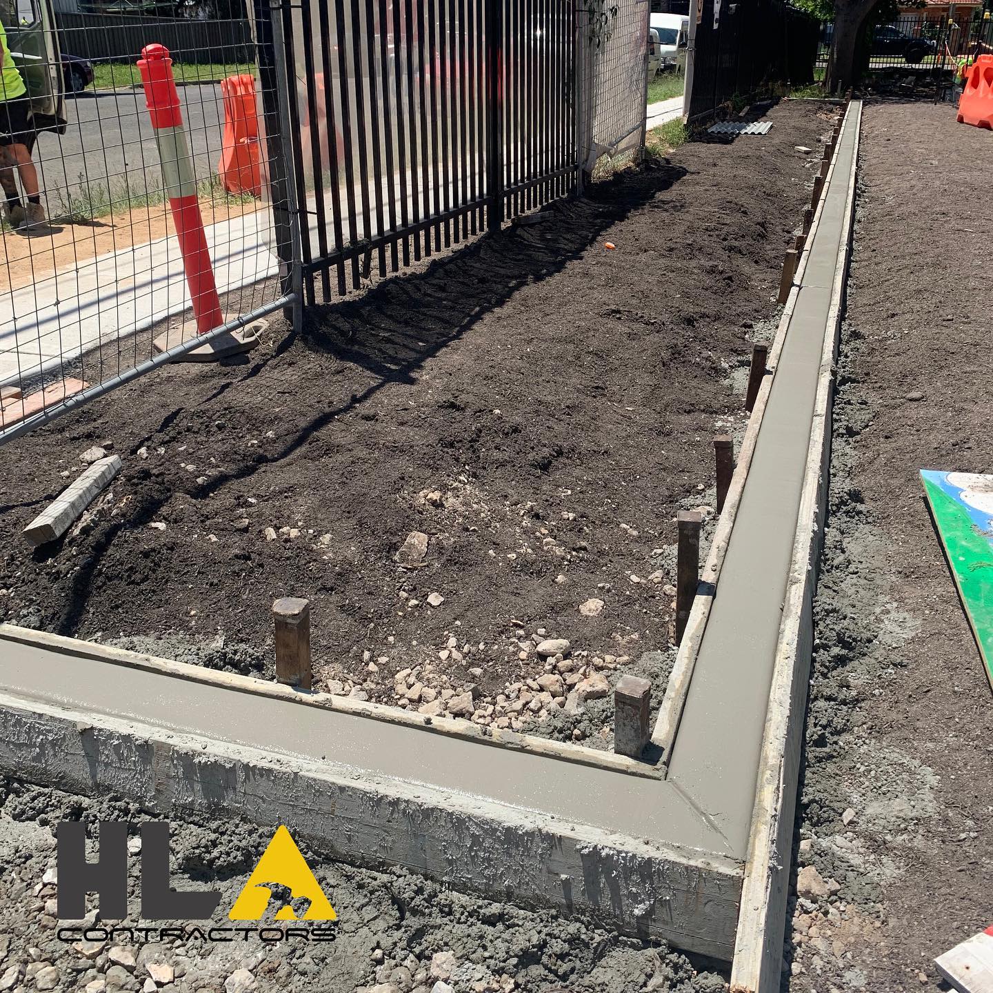 Concrete footing pour with reinforcement in a residential trench